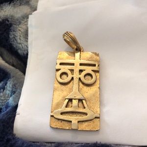 Gold color pendant with Egyptian pattern